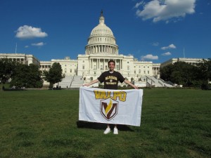Alexander-K.-Uryga-with-Valpo-flag-in-front-of-U.S.-Capitol-Building