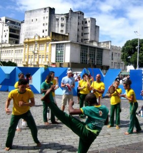 Playing tambourine in a group of Brazilian capoeristas