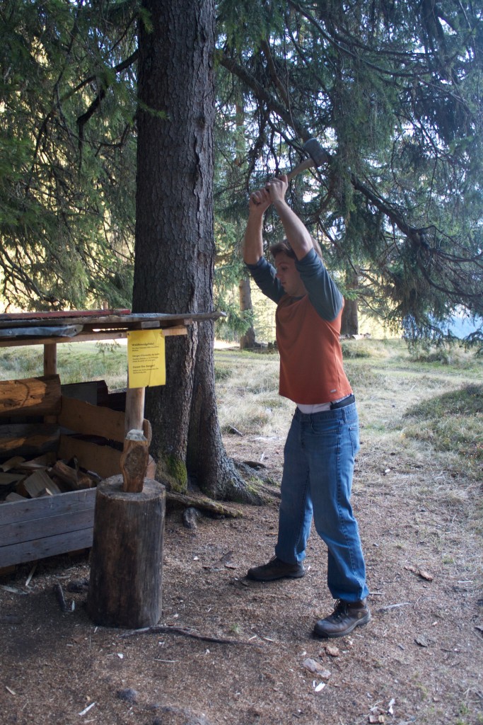 Nick trying his hand at chopping some wood at a little campsite area on top of a mountain. 