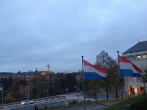 Flag of Luxembourg, from my brief stopover in the fall. The single car on the road does not reflect reality. 