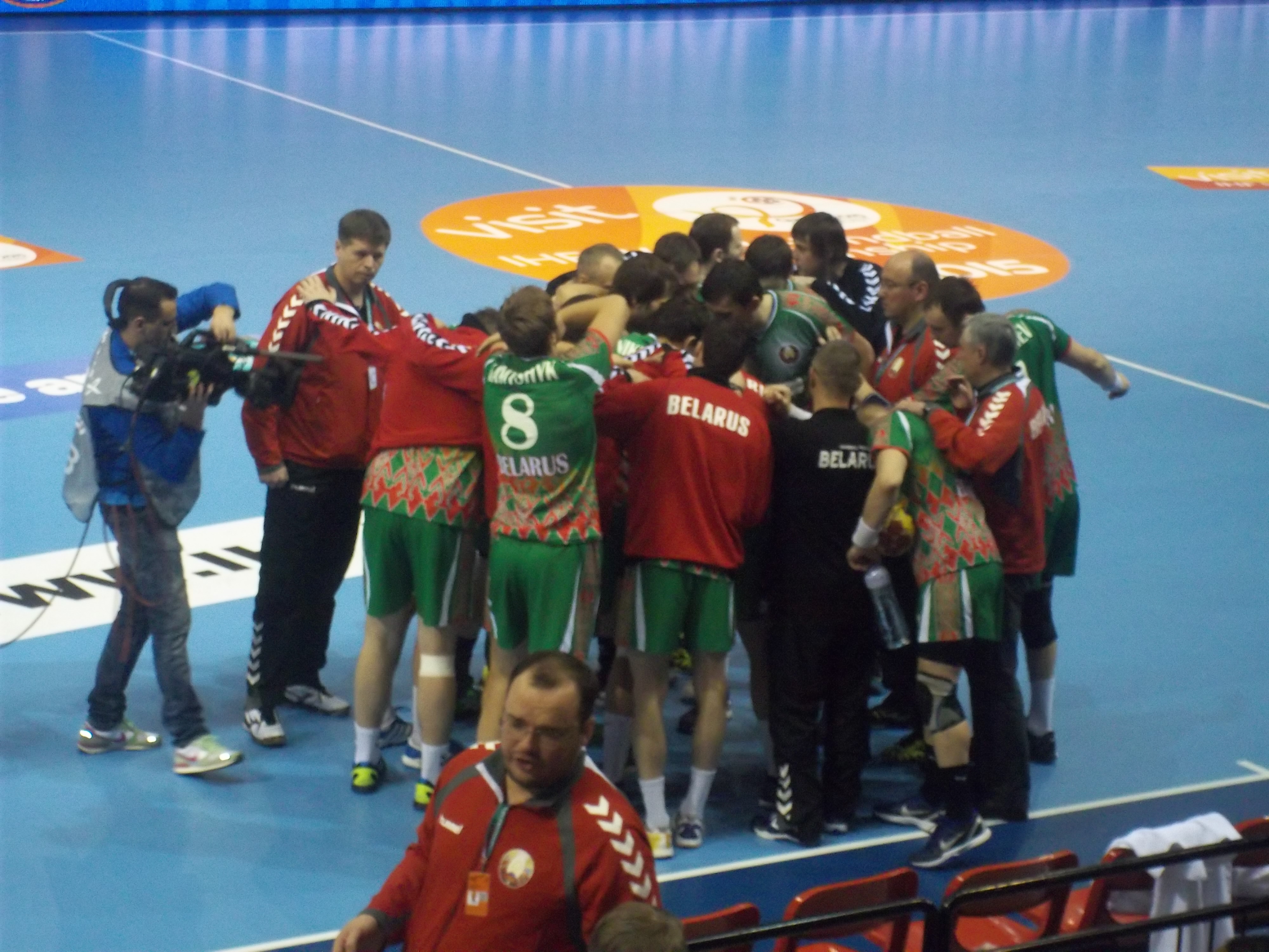 The men's handball team from Belarus huddles before their game against Saudi Arabia.